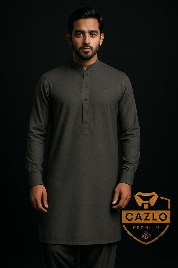 Man wearing a dark gray kurta with Cazlo Premium logo on a black background